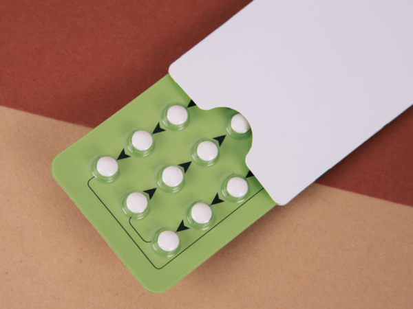 A close-up of medicine tablets in a blister pack, an example of primary packaging