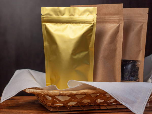 Coffee grounds contained in metallic pouches, an example of secondary packaging