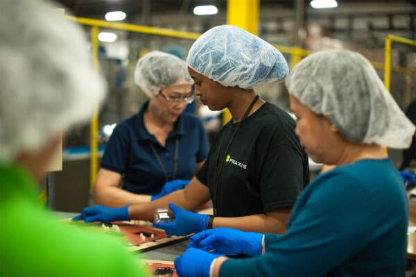 Secondary packaging operations carried out by Praxis Packaging employees in a FDA-compliant facility in Grand Rapids, MI
